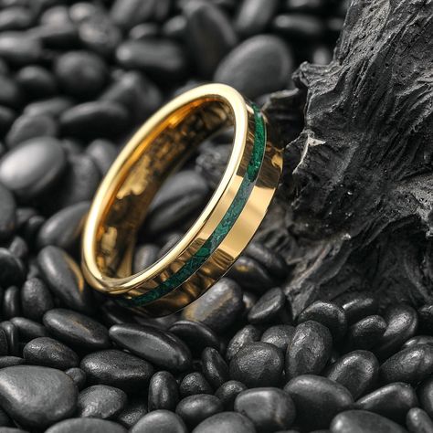 The wedding band is made of 6mm width gold plated tungsten carbide, that inlaid with crushed green malachite on the surface of the ring, and it also comes with beautifully polished beveled edges, This combination makes it an absolute eye-catcher. Due to its comfort fit interior and nice weight, it is comfortable to wear and fits most occasions in everyday life. ✔ Material: Tungsten Carbide ✔ Inlay: Malachite ✔Color: Gold ✔Band Width: 6mm ✔Polished Finish ✔FREE Shipping   ✔Free Engraving Service Mens Engagement Rings Emerald, Male Engagement Ring Green, Malachite Ring Men, Mens Green Wedding Bands, Men’s Wedding Bands With Emerald, Green And Gold Wedding Rings, Wedding Rings Green Stone, Emerald Wedding Rings Men, Green Stone Wedding Ring