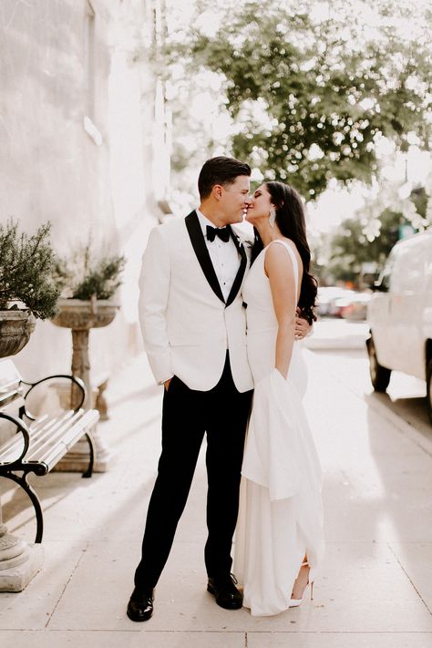 Bride and Groom wedding  day photos. Classic white tuxedo jacket for groom. Groom Attire All White, White Tux Black Pants Groom, All White Tuxedo Wedding Groom, White Coat Groom Wedding, White Bride And Groom Outfit, White Black Tuxedo Wedding, White Groom Tuxedo With Bride, Groom Attire White Suit, Groom Attire White Jacket