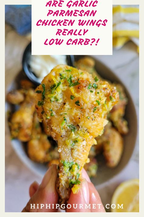 hand holding a garlic parmesan chicken wings over a bowl with more Chicken Wings Keto Recipe, Low Carb Wings, Keto Wings, Low Carb Chicken Wings, Keto Chicken Wings, Carb Cravings, Parmesan Chicken Wings, Garlic Parmesan Chicken Wings, Parmesan Recipes