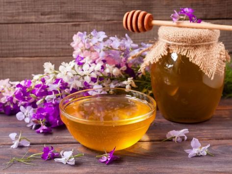 A jar and bowl of wildflower honey with fresh white and purple wildflowers on a wooden table Different Types Of Bees, Jar Of Honey, Types Of Honey, Types Of Bees, Wildflower Honey, Purple Wildflowers, Bee Hives, Honey Jar, The United Kingdom