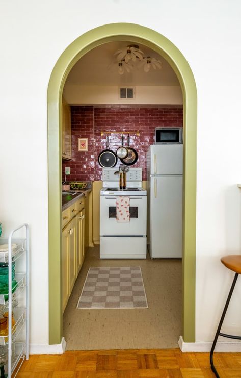 View looking into kitchen with yellow painted cabinets, a red tile backsplash, and dark brown speckled countertops Kitschy Kitchen Decor, Rental Kitchen Makeover, Kitschy Decor, Replacing Kitchen Countertops, Funky Home, Strawberry Kitchen, Rental Kitchen, Kitschy Kitchen, Kitchen Decor Ideas