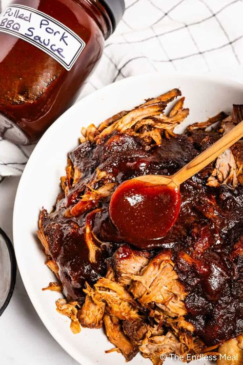 Pork is always tasty, but when it's bathed in a delicious homemade BBQ sauce for pulled pork and then slow-cooked until it falls apart, it ascends to a whole new level! Strands of tender pork are the perfect canvas to soak up the smoky, tangy, sweet, and savory flavors of rich BBQ sauce. Who needs to go to a smokehouse when you can make a hickory BBQ sauce in your own kitchen?! #theendlessmeal #bbqsauce #pulledpork #pork #bbqpork #sauce Pork Bbq Sauce Recipe, Bbq Sauce For Pulled Pork, Pulled Pork Sauce Recipe, Sauce For Pulled Pork, Pulled Pork Bbq Sauce, Bbq Pork Loin, Pulled Pork Sauce, Pulled Pork Enchiladas, Barbeque Pork