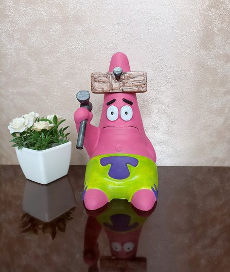 Complete the decor of your desk with this Hammered Patrick figure that appeals to fans of Spongebob Squarepants. This figure by Nickelodeon, with collectible value, will add a unique touch to your desk. Create a nostalgic atmosphere in your home or office with this limited edition figure. Model made by- Ricardo Salomao https://www.myminifactory.com/object/3d-print-hammered-patrick-11323 Spongebob Pottery, Spongebob Room Decor, Spongebob Clay, Spongebob Items, Patrick From Spongebob, Spongebob Crafts, Spongebob Birthday Party Decorations, Spongebob Birthday Party, Sesame Street Cookie Monster