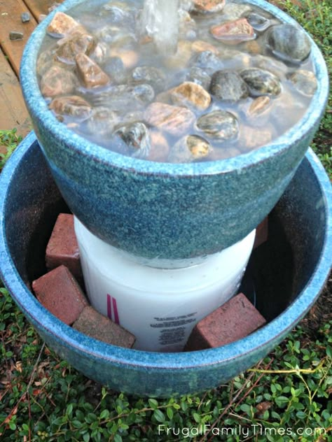 How to build a simple bubble fountain for your backyard or deck. This was a quick and easy DIY - it only took an afternoon! This style of fountain uses two or more pots - and has a relaxing bubbling sound and pretty waterfall effect down the sides. A lovely feature for any garden - even if you have a small budget! Bubble Fountain, Pretty Waterfall, Diy Solar Fountain, Diy Water Feature, Diy Water Fountain, Fountain Ideas, Garden Water Feature, Fountains Backyard, Diy Garden Fountains