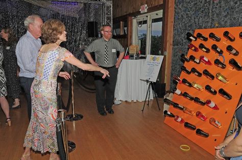 The classic Wine Ring Toss                                                                                                                                                                                 More Wine Bottle Ring Toss Game, Wine Ring Toss, Wine Toss Game Fundraiser, Wine Bottle Ring Toss, Fundraiser Games For Adults, Bottle Toss Game, Wine Pull Fundraiser, Fundraiser Games, Auction Games