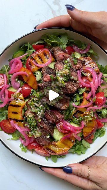 Carina Wolff on Instagram: "steak & peach salad with sizzled scallion chimichurri! forever inspired to have a steak salad summer by our queen @chacekitchen! RECIPE BELOW!

first, hanger steak — the only steak I cook with. so good. third, this chimichurri is a blend between a chinese scallion sauce and an argentinian chimichurri. it’s a fusion, so it’s not an authentic prep of either of these sauces, but it sure is tasty!

recipe (serves 2)

salad
-16 oz hanger steak
- 1 tbsp avocado oil 
-1 large yellow peach, sliced
- 4 cups arugula
-1 cup quartered cherry tomatoes
-2 small persian cucumbers, sliced
-¼ cup pickled onions

sizzled scallion chimichurri

-3 large scallions, thinly sliced
1/4 tsp crushed red pepper
1 tbsp dried oregano
¼ cup olive oil, plus more to taste
1 shallot, cut into w Season Steak, Argentinian Chimichurri, Entree Salads, Scallion Sauce, Scallion Oil, Steak Salad Recipe, Salad Summer, Hanger Steak, Recipe List