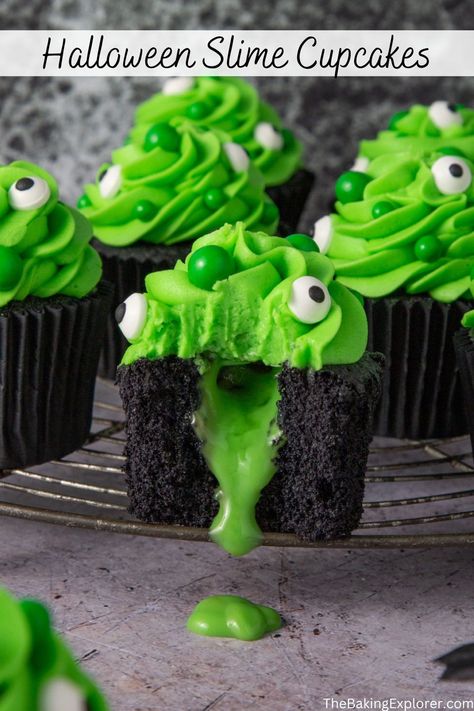 Recipe for Halloween Slime Cupcakes - black vanilla sponge, bright green buttercream, and creepy candy eyes. Filled with edible green slime! A fun spooky recipe for Hallowen #thebakingexplorer #halloweencupcakes #halloweenbaking #spookyseason #slimecupcakes Slime Themed Cupcakes, Slime Filled Cupcakes, Homemade Halloween Cupcakes, Halloween Desserts Easy Cupcakes, Green Halloween Food, Green Halloween Snacks, Halloween Cupcakes Recipes, Cupcake Halloween Ideas, Halloween Baking Ideas Desserts