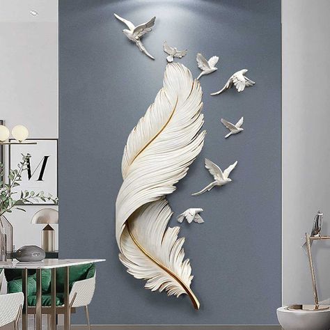 PRICES MAY VARY. 1. The Noble Large Feather Wall Decoration is a high-end wall art piece crafted in white metal that features seven flying birds and three-dimensional, vivid feathers. This eye-catching design adds unparalleled luxury and vitality to any home; 2. Eco-Friendly Material: Made from high-quality FRP resin, a green and environmentally friendly material composed of resin and glass fiber. The decorative sculpture is tasteless, ensures no fading, and is resistant to deformation, embellis Wall Decor Luxury, Feather Wall Decor, Feather Lamp, Wall Nails, Feather Wall Hanging, Wing Wall, Metal Wings, Modern Minimalist Living Room, Large Feathers