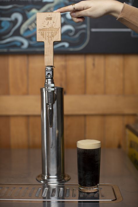 This is our Deep Steep Nitro Cold Brew. This is the tap handle we'll be putting the art onto (current art shown). Nitro Cold Brew is a variation of cold brewed coffee that uses the addition of nitrogen gas to create a smooth texture. Our nitro is 'deep steeped' meaning that we steep our cold brew coffee a little longer than others for a rich, chocolatey, smooth cold coffee. Server Station, Cold Brewed Coffee, Moon Milk, Nitro Cold Brew, Brewed Coffee, Cold Coffee, Brew Coffee, Tap Handles, Cold Brew Coffee