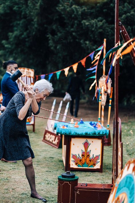 Wedding guest competes in fairground games at wedding Pheras Decor, Games At Wedding, Colourful Bunting, Signage Lighting, Fairground Games, Cheese Wedding Cake, Party Styling, Garden Games, Sensory Friendly