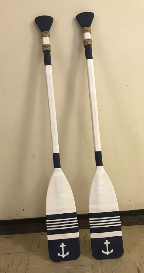 Painted Oar Designs, New England Nautical Style, Painted Boat Oars, Boat Paddle Ideas Diy Painted Oars, Paddle Decor Ideas, Painted Paddles Ideas, Oars On Wall Decor Ideas, Painted Oars Paddles, Home Interior Bathroom