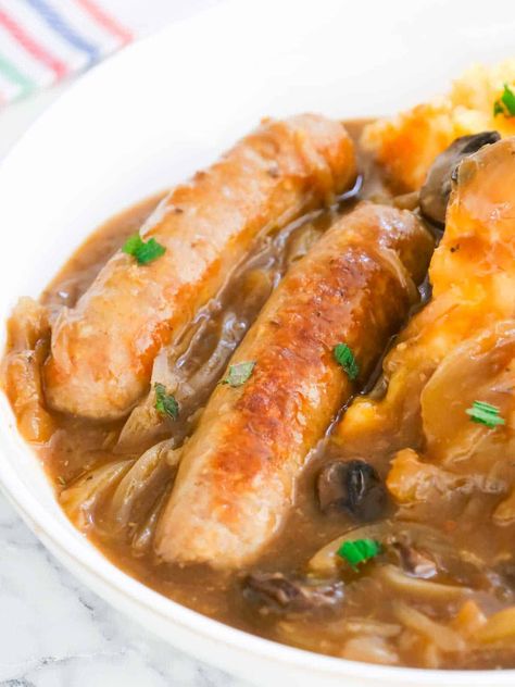 Slow Cooker Sausage And Onion Gravy, Slow Cooked Sausage Casserole, Sausage Recipes In Crockpot, Sausage In Onion Gravy, Stewed Sausages Recipe, Pork Sausage Meals, Pork Sausages Recipe, Slow Cooker Recipes Sausage, Sausage Slow Cooker Recipes