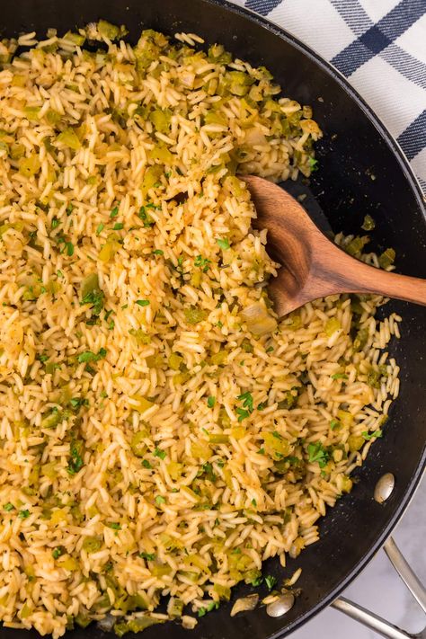 Classic, bold flavors marry together in this cajun rice recipe with tender bell pepper, onion, and celery. Toss it with fragrant basmati rice for a mouthwatering Southern side to bring the spice to any main dish. Cajun Style Rice, Easy Cajun Rice, Rice With Green Onions, Cajun Rice Dressing Louisiana, Southern Rice Recipes, New Orleans Rice, Cajun Rice Recipes, Bell Pepper Rice Recipe, Southern Rice