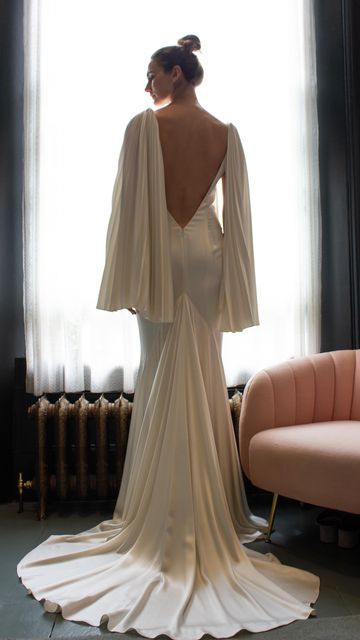 Halfpenny London | Wedding Dresses & Separates on Instagram: "The juxtaposition of structure and softness is so compelling to me and I adore the angelic, wing-like sleeves we created for the Hula dress. A dramatic low back and a magnificent, full godet flowing into a beautiful train were the finishing touches for this gown. Find your nearest place to try via the link in our bio. #HPLCourage #HalfpennyLondon" Handfasting Dress, Hula Dress, Dramatic Wedding Dress, Wedding Dress Separates, Halfpenny London, Dress Inspo, London Wedding, Long Wedding Dresses, Low Back