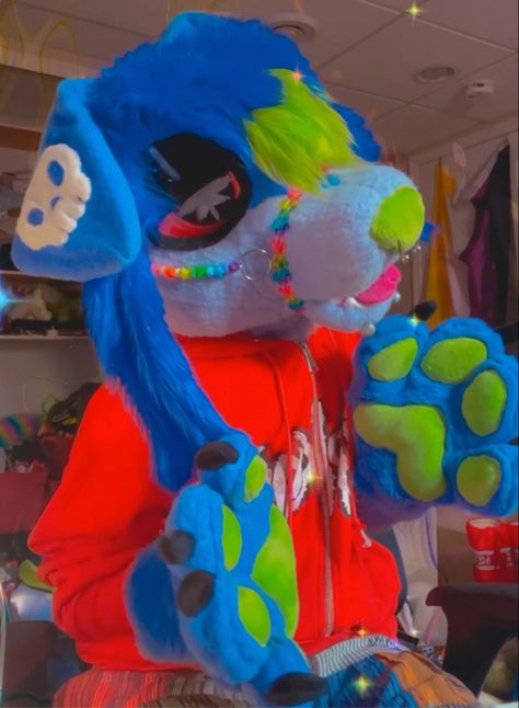 A green and purple dog fursuit