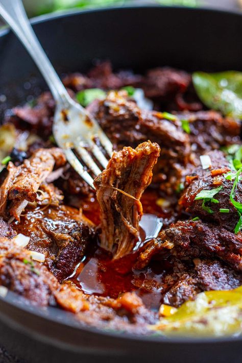 This simple, delicious Barbacoa recipe hails from the Oaxacan region of Mexico, resulting in the most flavorful, tender, fall-off-the-bone meat. Slow roast it in your oven or use a slow cooker. Perfect in tacos or burritos. Mexican Goat Recipes, Lamb Tacos Slow Cooker, Barbacoa Dutch Oven, Mexican Beef Crockpot, Mexican Bbq Ideas, Best Barbacoa Recipe, Barbacoa Burritos, Authentic Birria Recipe, Tacos Barbacoa