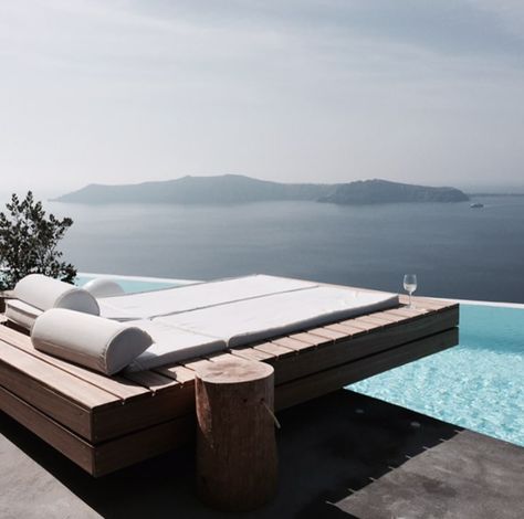 Concrete and wood accented outdoor area | modern | day bed overhanging pool Pool Daybed, Floating Daybed, Modern Day Bed, Pool Platform, Raised Pools, Built In Daybed, Mediterranean Pool, Pool Bed, Mediterranean Exterior