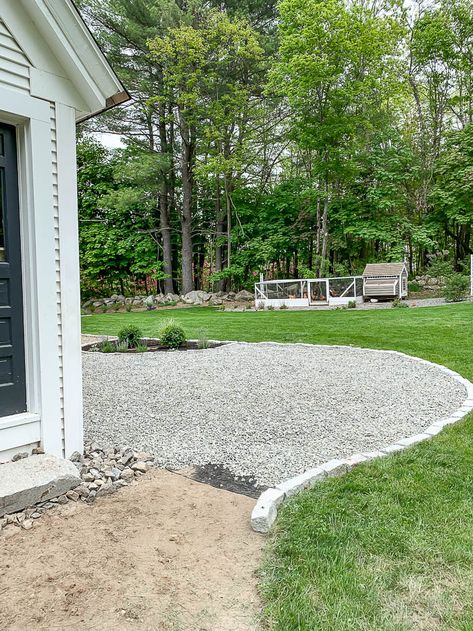 I'm so excited to share this project with you today. How we installed   the gravel patio around our fire pit area. New gravel patio area next to   the house. I included a full budget breakout. New Gravel Patio - Rooms   For Rent blog #newpatio #gravelpatio #homedesign #installation   #budgetbreakdown #blogpost #homeimprovement Side Yard Gravel Landscaping, Pea Pebble Patio Backyard Ideas, River Rock And Pea Gravel Landscaping, Beautiful Pea Gravel Patios, Peastone Patio Ideas, Gravel In Backyard, Garden White Stones, Stone Outdoor Flooring, Backyard Gravel Ideas