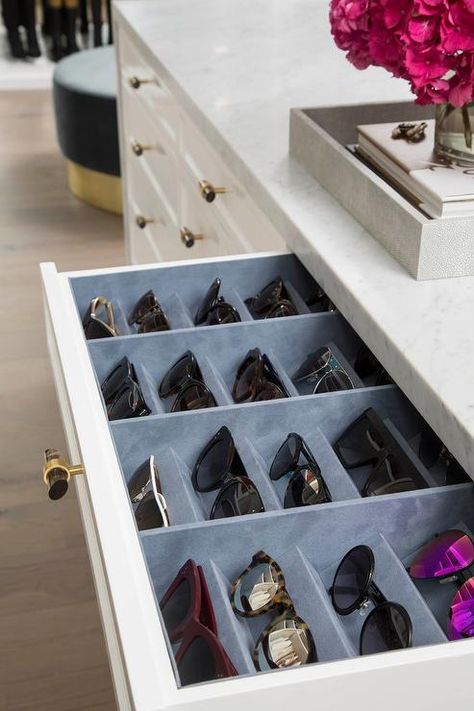 A white closet island drawer accented with a gray glass and brass knob opens to reveal a blue velvet sunglass organizer fitted beneath a marble countertop. Storage Tricks, Chic Closet, Closet Island, White Closet, Dream Closet Design, Drawer Inserts, Closet Decor, Organize Drawers, Room Closet