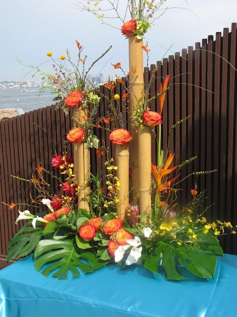 Bamboo Flowers Decoration, Bamboo Arrangement Ideas, Bamboo Table Decor, Bamboo Centerpieces Party Ideas, Bamboo Flower Arrangement, Bamboo Arrangement, Hawaiian Centerpieces, Bamboo Centerpieces, Tropical Centerpieces