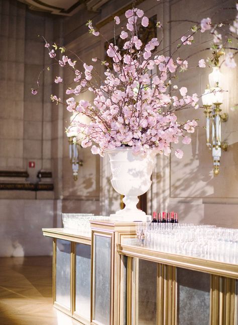 Tall Cherry Blossom Flower Arrangement on Gold Bar Cherry Blossom Centerpiece, Hotel Flower Arrangements, Creative Wedding Centerpieces, Tall Flower Arrangements, Urn Arrangements, Hotel Flowers, Easter Flower Arrangements, Table Flower Arrangements, Cherry Blossom Wedding