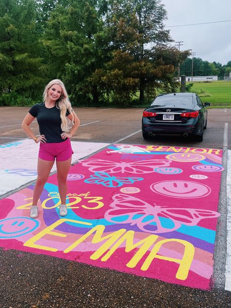 My senior parking spot!!! Smiley faces, butterflies, pink, preppy, all my fav things!!! 💖💖🦋😇 Hot Pink Senior Parking Spot, Rainbow Parking Spot, Graffiti Senior Parking Spot, Hot Pink Parking Spot, Colorful Senior Parking Spots, Senior Parking Spots Butterfly, Senior Parking Space Ideas Butterfly, Parking Lot Senior Painting, Parking Spot Painting Unique