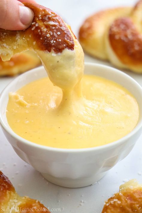 This Pretzel Cheese Dip is thick and creamy, full of cheddar cheese, butter, mustard, and hot sauce. Your pretzel is going to taste amazing when you serve it with this dip. #dip #pretzeldip #pretzelcheesedip #pretzelcheesediprecipe Cheese Dip With Velveeta, Pretzel Cheese Dip, Pretzel Dip Recipes, Rotel Cheese Dip, Layer Taco Dip, Easy Cheese Dip, German Cheese, 7 Layer Taco Dip, Mustard Pretzels