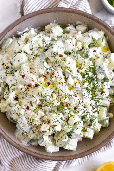 Fresh cucumber yogurt salad is a delicious and easy spin on tzatziki sauce. Made with cucumbers, greek yogurt, feta, fresh dill, & lemon juice Cucumber Yogurt Salad, Healthy Cucumber Salad, Cucumber Feta Salad, Yogurt Salad, Cucumber Dill Salad, Chicken Caesar Pasta Salad, Cucumber Yogurt, Fresh Cucumber, Vegetable Snacks