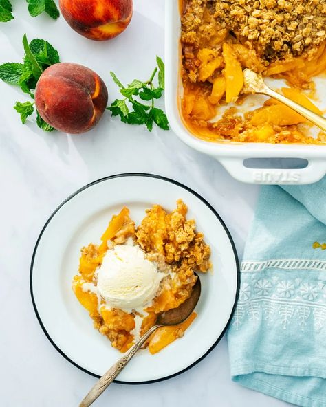 Perfect Peach Crisp – A Couple Cooks Oatmeal Pudding, Gluten Free Peach Crisp, Peach Pie Bars, Gluten Free Crisps, Peach Oatmeal, Baked Rice Pudding, Peach Crisp Recipe, Frozen Peaches, A Couple Cooks