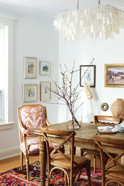 For a pretty look, upholster the two end chairs in your dining room with a bright, playful pattern. #diningroom #diningtable Fashion Show Room, White Living Room Chairs, Tartan Sofa, Design Small Apartment, Library Dining Room, Apartment Ideas Living Room, Home Eclectic, Small Apartment Ideas, Bohemian Interiors