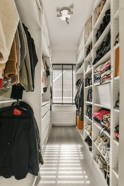 Premium Photo | A walk in closet filled with clothes and a window Country Walk In Closet, Walkthrough Closet, Rustic Walk In Closet Storage, Dark Wood Closet Walk In, Walk In Closet Ideas Dark Wood, Rustic Walk-in Closet Ideas, Walk Through Closet, Free Business Card Mockup, Business Card Maker