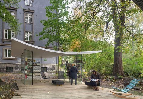 Completed in 2020 in Tallin, Estonia. Images by Paco Ulman. “White Sheet” is a tiny public library or a reading pavilion located in Kadriorg, Tallinn, with its architecture inspired by the image of a literary... Library Pavilion, Textile Pavilion, Light Pavilion Architecture, Abstract Pavilion Architecture, Famous Pavilion Architecture, Social Control, Wooden Terrace, Pavilion Architecture, Architectural Competition