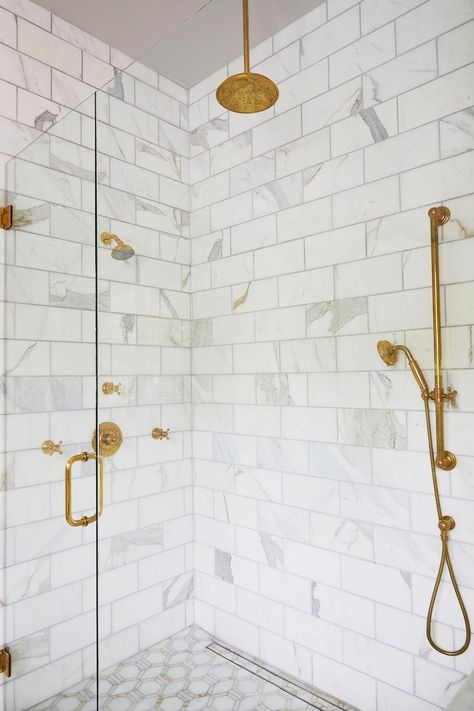 Marble zero entry shower with linear drain and stone inlay Calcutta Gold Marble Bathroom, Brick Tile Backsplash, Marble Shower Walls, Calcutta Gold Marble, Ceiling Paint Colors, Beveled Subway Tile, Blue Glass Tile, Calcutta Marble, Painted Brick House