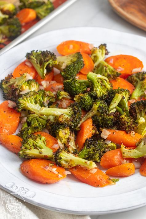 Roasted Broccoli and Carrots with a lemon shallot vinaigrette are the most versatile, delicious, and easy to make veggie side dish. Carrot And Broccoli Side Dish, Best Roasted Broccoli, Roasted Broccoli And Carrots, Broccoli And Carrots, Shallot Vinaigrette, Veggie Side Dish, Honey Carrots, Broccoli Side Dish, Oven Vegetables