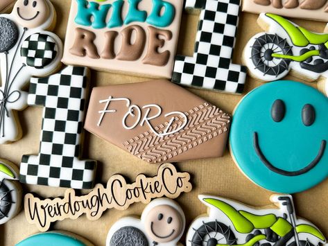 Ford’s first year was One Wild Ride 🏍️🏁 • How fun and cute of a theme is this!? This riding theme was a first for me and I couldn’t wait to get started! I was so excited when this sweet mama, @brie_matthews, reached out for Ford’s 1st birthday with these ideas! Bringing them to cookie life was a blast and it was a cherry on top seeing his party tie everything together! Also, can we talk about these colors? I love them together!! • • • #onewildride #firstbirthday #birthdayboy #customcookies #b... Birthday Party For Boys, 2nd Birthday Party For Boys, Can We Talk, Cherry On Top, Custom Cookies, Brie, First Year, Boy Birthday, So Excited