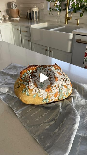 Loveall Design Co.™ on Instagram: "Since the repost of my viral painted sourdough loaf has gone viral again and I’m getting lots of questions about the process, I thought I’d reshare a tutorial on how I paint on my sourdough! First off, yes this is 100% edible food colorings — ya know, the ones you use to color icing for cakes and stuff? 🤗They are just the gel style to remain thick like acrylic paint. Here is a list of supplies I use (everything is linked in my amazon storefront in my bio) and some directions:

SUPPLIES
For the food paint:
- Liquid Food Whitener (from @chefmaster )
- Food Coloring Gels (I prefer @wiltoncakes , but have used others)
- Palette to mix on (I found this ceramic palette from amazon that I love)
- Water
- Paint brush (I prefer round tip) 
- Something to scoop ou Painted Sourdough Loaf, Painting On Sourdough, How To Paint Sourdough Bread, Painted Sourdough Bread, Sourdough Painting, Icing For Cakes, Sourdough Designs, Bread Painting, Painted Bread