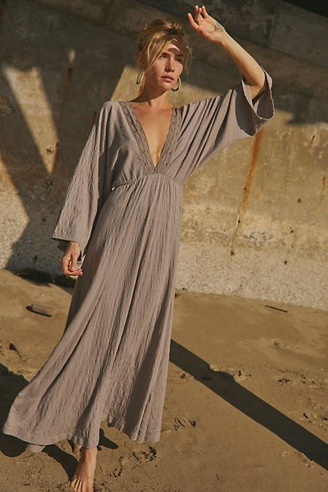 Effortlessly ethereal, this staple maxi from our free-est collection will be a go-to for seasons to come. **Fit:** Billowy, A-line silhouette **Features:** Plunge neckline, crochet lace trimming, backless design with tie closure, textured smocked fabrication, exaggerated sleeves **Why We ❤ It:** Elevated with strappy heels or off duty with simple flats, this style will turn heads with every wear. | Eliza Maxi Dress by free-est at Free People in Grey, Size: S Solid Midi Dress, Backless Design, Plunge Neckline, Satin Midi Dress, Midi Maxi Dress, Lace Maxi Dress, White Maxi Dresses, Womens Maxi Dresses, Off Duty