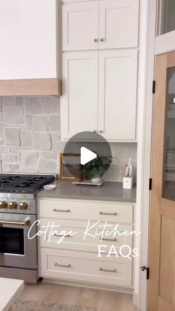 Tracy Baggett on Instagram: "Cottage kitchen @peninsulapinescottage FAQs and Answers!   1) What is your cabinet color? Cabinets are @sherwinwilliams White Duck. It’s the perfect creamy hint of beige white.  2) Where did you find the backsplash? Stone backsplash is @flooranddecor Alamo Sandstone Random Ledger Panel - I’ll share install details in another reel! 3) Stool link? Stools are an Amazon find! Write SHOP below for the exact link. 4) Countertop Info? The island is Lumataj stone quartz (a great option to save $ if you like the look of Taj Mahal quartzite! Perimeter is Daintree Gray quartz. 5) Brass Shelf Rail info? I ordered from Etsy! Linked by commenting SHOP. 6) Flooring details? LVP from @duradecor - San Tropez 7) Lighting link? From @hunterfanco  8) Hardware source? Also from Ama Alamo Sandstone Random Panel Ledger, Gray Quartzite Countertops, Brass Shelf Rail, Kitchen Island Cabinet, Taj Mahal Quartzite Countertops, Taupe Kitchen Cabinets, Shelf Rail, Color Cabinets, Stone Kitchen Island