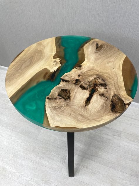 A unique round table with epoxy resin, made of high quality natural wood.🌿✨ Its turquoise epoxy resin "river" effectively emphasizes the natural texture of the wood and creates a bright accent in any interior. Sturdy metal legs provide reliable stability and add a modern look. This handmade piece is ideal for the living room, dining room or kitchen, and can also serve as a unique gift for connoisseurs of exclusive furniture.🌿✨ Production takes 4-5 weeks, depending on the complexity of the prod Unique Round Table, Table With Epoxy Resin, Table With Epoxy, Coffee Table Resin, Coffee Table Epoxy, Epoxy Coffee Table, Resin Coffee Table, Table Resin, Table Epoxy