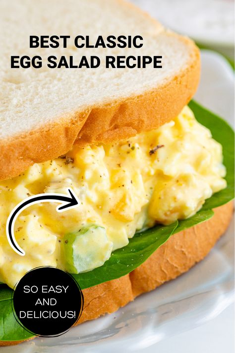 A closeup of an egg salad sandwich with spinach on white bread. Crunchy Egg Salad Recipe, Egg Salad With Green Onions, Egg Salad Recipe With Celery, Egg Salad With Cheese, Egg Salad Recipe With Pickles, Celery Breakfast, Egg Salad With Celery, Celery Pickles, Egg Salads