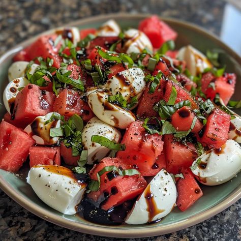 🍉 Refresh with Watermelon Caprese Salad! 🌿 #FreshEats 🍽️ Watermelon Caprese Salad 🛒 Ingredients: Watermelon: 2 cups, cubed Fresh mozzarella: 1 cup, cubed Fresh basil: A handful Olive oil: 2 tbsp Balsamic reduction: 1 tbsp Salt and pepper: To taste 👩‍🍳 Instructions: Layer: Alternate watermelon and mozzarella on a platter. Drizzle: Add olive oil and balsamic reduction. Season: Sprinkle with salt, pepper, and basil. Serve: Fresh and vibrant! 💚 Refresh your palate with our Watermelon Caprese ... Watermelon Mozzarella Salad, Watermelon Caprese, Watermelon Caprese Salad, Bocconcini Salad, Watermelon Basil, Fresh Eats, Mozzarella Salad, Instagram Recipes, Twisted Recipes