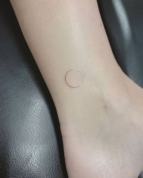 Small and minimalist sun and moon ankle tattoo Circle Tattoo Minimalist, Minimalist Circle Tattoo, Single Needle Moon Tattoo, Circle Line Tattoo, Simple Circle Tattoo, One Needle Tattoos, Minimalist Foot Tattoo, Circular Tattoo Placement, 3 Lines Tattoo