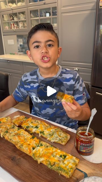 Cooking With Evan on Instagram: "Chilli Crunch Garlic Bread, Let’s Go !!!
Oh my god, I finished a quarter of this entire loaf. Here is the recipe. Roast garlic in the oven for 40-45 minutes at 400 with salt and olive oil. Let cool and set aside. And the food processor combine soft butter, parsley, salt, crunchy chili, and your squeezed, roasted garlic to make a beautiful paste or compound butter. 

Split your bread and apply generously your comp , with your favorite cheeses and put back in the oven for about 10 minutes. I finished mine with the broiler for a minute to get that extra color.. 

Once out, you can eat it as is or put in some meat and enjoy a garlic bread sandwich . Enjoy !! (Adult supervision required) #cook #cooking #garlicbread #cheesy #cheesybread #garlic" Cheesy Garlic Bread Loaf, Garlic Bread Breakfast Ideas, Stuff Bread Recipes, Recipes With Bread Dough, Garlic Bread Sandwich, Garlic In The Oven, Apple Crisp Bars Recipe, Chili Crunch, Roast Garlic