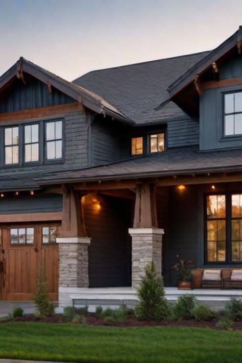 Modern two-story house with a wooden garage door, stone accents, and warm exterior lighting at dusk. White House Black Trim Exterior Craftsman Style, Craftsman Style Ranch Homes Exterior, Dark Brown House With Black Trim, Blue Craftsman House Exterior, Cedar Trim Exterior, Blue Craftsman Exterior, Front Porch On Ranch Style House, Wood Siding House Exterior, Craftsman House Colors Exterior