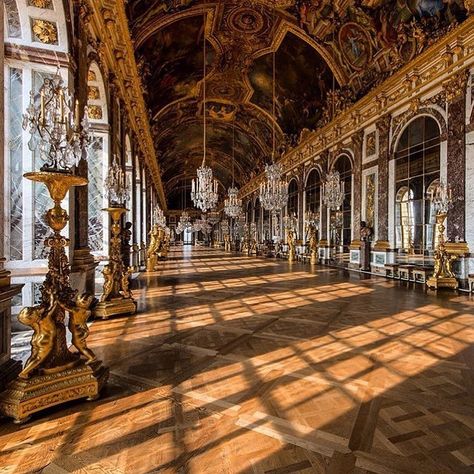 Hall of Mirrors, Palace of Versailles, France 🇫🇷 The opulent Hall of Mirrors inside the Palace of Versailles, bathed in golden sunlight. The grand hall features 17 mirrored arches that reflect the gardens through the windows opposite, creating a dazzling display of light. The ornate chandeliers, gilded statues, and elaborate ceiling frescoes embody the grandeur of the French Baroque style. This iconic space once hosted royal ceremonies and is a testament to the extravagant lifestyle of Louis... Inside Palace, Hall Of Mirrors Versailles, Extravagant Lifestyle, Golden Hall, The Palace Of Versailles, French Baroque, Versailles France, Hall Of Mirrors, Grand Hall