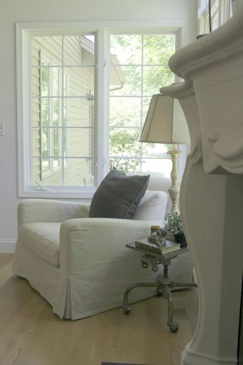 Belgian style in living room by Hello Lovely Studio Rustic Round Dining Table, Serene Living Room, Linen Dining Chairs, Belgian Style, Peaceful Home, Linen Armchair, Kitchen Paint Colors, Country Living Room, Hello Lovely