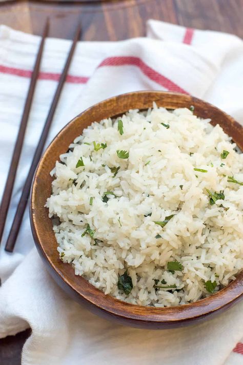 Add some interest to your next Asian or Indian-inspired entree and serve it with Coconut Rice with Cilantro and Lime. Your taste buds will thank you. #rice #coconutrice #coconutmilk #sidedish Rice With Cilantro And Lime, Rice With Cilantro, Jasmine Rice Recipe, Best Sushi Rice, Indian Entree, Coconut Jasmine Rice, Panang Curry Recipe, Jasmine Rice Recipes, Lime Rice Recipes