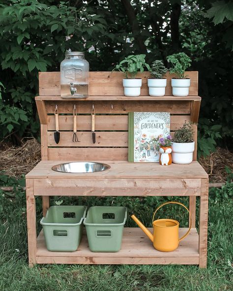 The Mini Potting Station *MUD KITCHEN & POTTING STATION PREORDERS OPEN FRIDAY, MAY 24, 2024 AT 10AM* The Mini Potting Station is a fantastic addition for young gardening enthusiasts. It resembles our standard-sized Potting Station, but was specially designed with toddlers and smaller spaces in mind. Its smaller size allows little ones to comfortably reach and engage in various gardening activities and aims to foster a sense of autonomy as they learn to work independently. The Mini Potting... Garden Potting Station, Backyard Play Spaces, Toddler Garden, Flower Station, Potting Station, Gardening Activities, Play Area Backyard, Backyard Kids Play Area, Diy Mud Kitchen