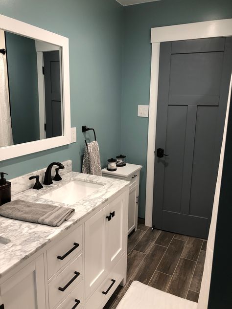 Our finished bathroom with paint color Sherwin Williams “Interesting Aqua” on the walls Bathroom Inspo Wall Color, Teal Gray Bathroom, Bathroom Remodel Paint Color Schemes, Bathroom Wall Colors Paint, Bathroom Remodel Colors Schemes, Interesting Aqua Sherwin Williams, Paint Colors For Bathroom Walls, Small Bathroom Colour Schemes, Aqua Bathroom Ideas