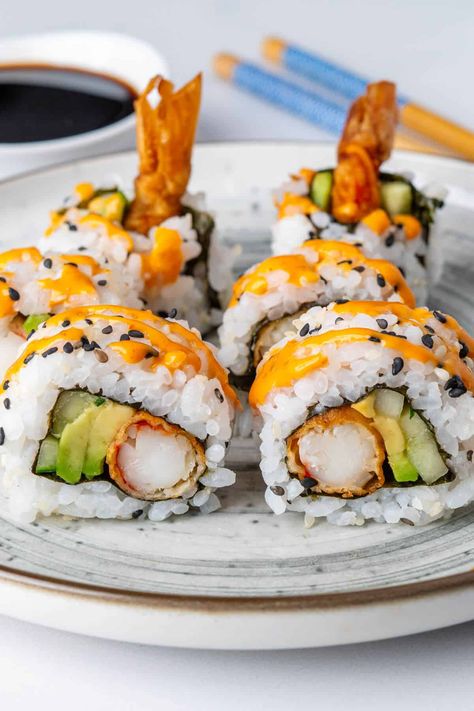 Have a fun sushi night at home and make this Shrimp Tempura Roll using my easy steps to guide you. It's the perfect combination of crispy shrimp tempura, creamy avocado and cucumber with a drizzle of spicy mayo for a little kick! Sushi Night At Home, Shrimp Sushi Rolls, Shrimp Tempura Sushi, Tempura Sushi, Avocado And Cucumber, Shrimp Tempura Roll, Tempura Roll, Shrimp Sushi, Sushi Roll Recipes